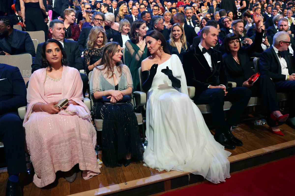 The Prince and Princess of Wales speak to Emma Baehr, BAFTA Director of Awards & Content, and Jane Millichip, CEO of BAFTA, as they take their seats ahead of the EE BAFTA Film Awards 2023 at the Royal Festival Hall on February 19, 2023 in London, England (Chris Jackson/Getty Images)