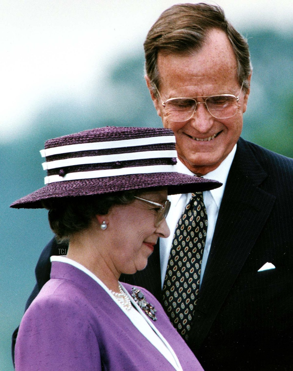 US President George Bush talks to Queen Elizabeth II during a welcoming ceremony at the White House in Washington, D.C. on May 14, 1991 (JEROME DELAY/AFP via Getty Images)