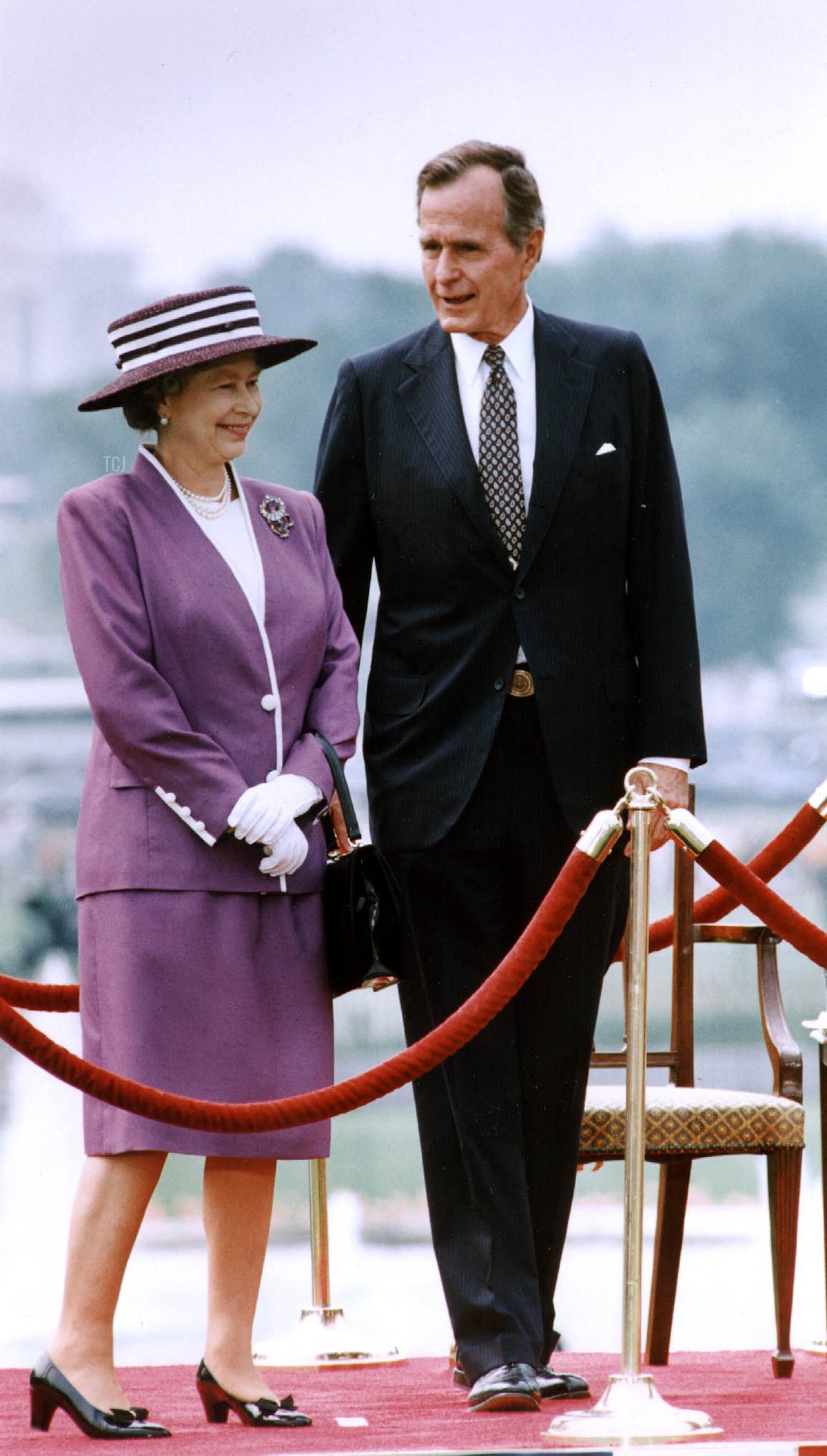 US President George Bush talks to Queen Elizabeth II during a welcoming ceremony at the White House in Washington, D.C. on May 14, 1991 (JEROME DELAY/AFP via Getty Images)