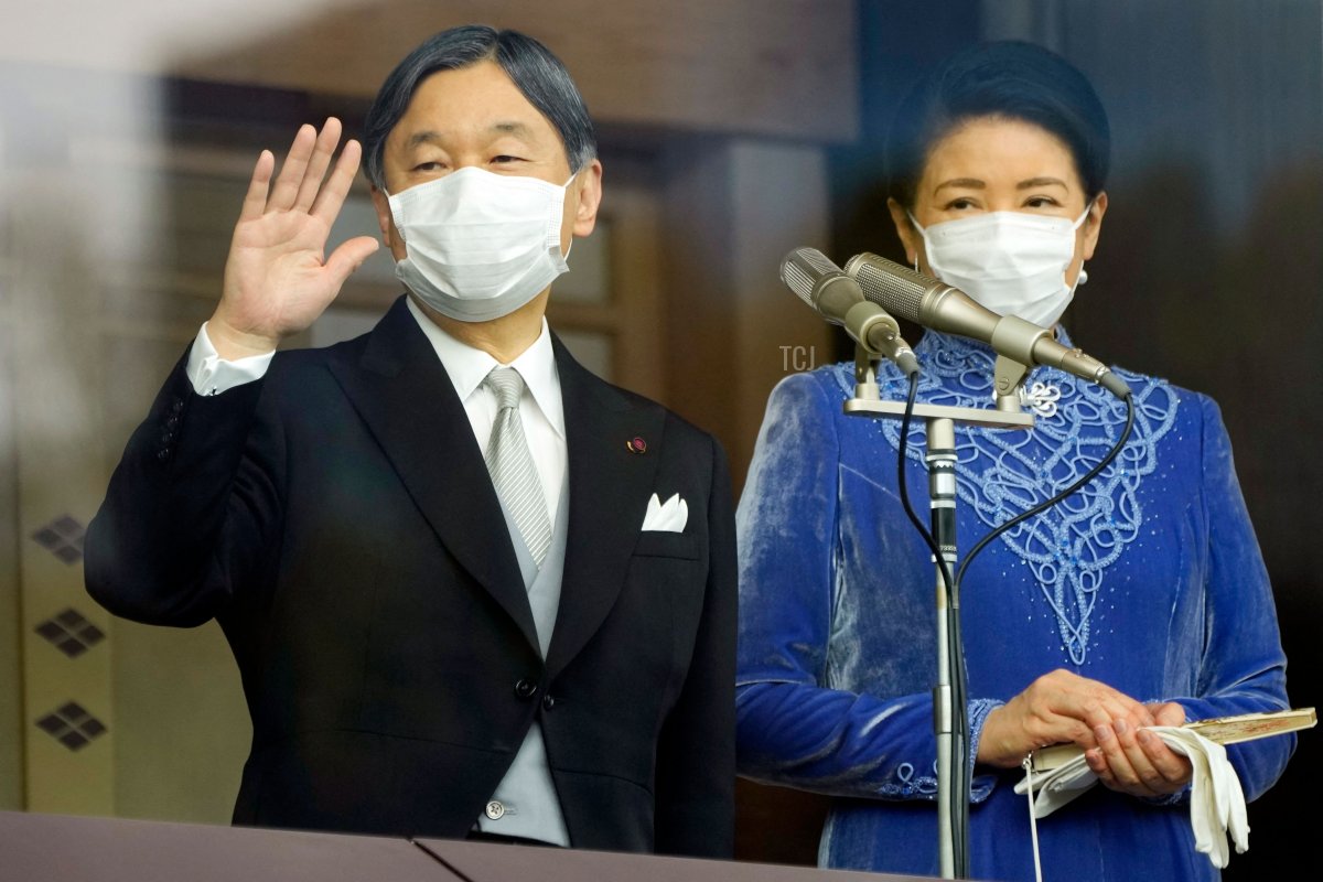 Emperor Naruhito and Empress Masako of Japan greet people during his birthday celebrations at the Imperial Palace on February 23, 2022 (EUGENE HOSHIKO/POOL/AFP via Getty Images)