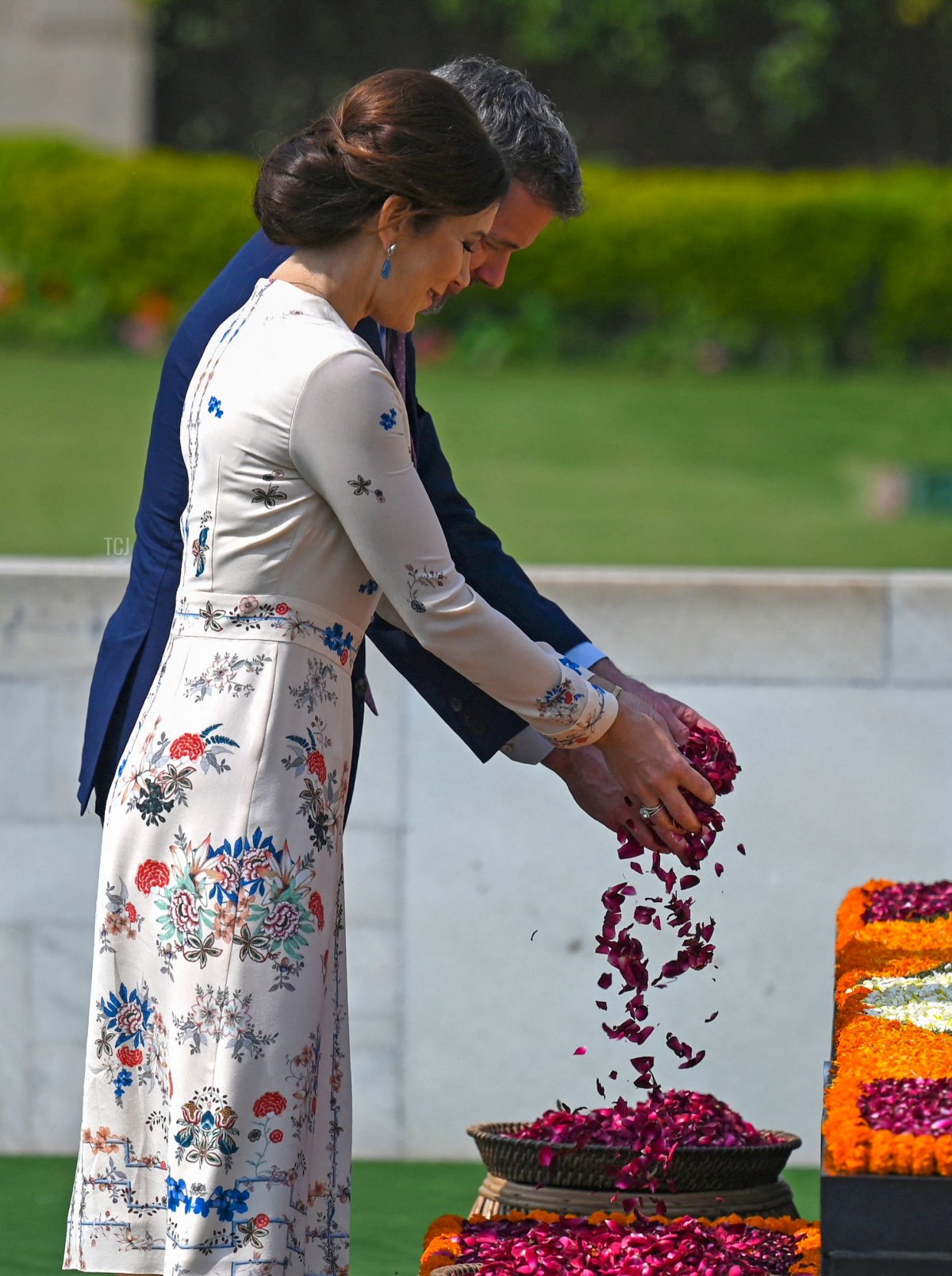 Denmark's Crown Prince Frederik and Crown Princess Mary scatter rose petals at the Mahatma Gandhi memorial at Rajghat in New Delhi on February 27, 2023 (MONEY SHARMA/AFP via Getty Images)