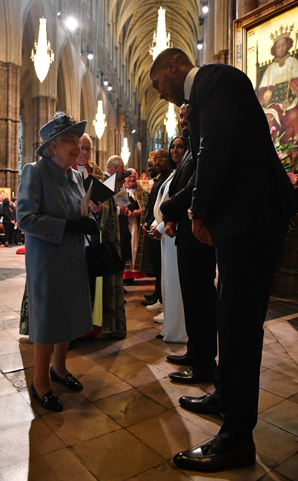 Queen Elizabeth II talks with British boxer Anthony Joshua as she leaves after attending the Commonwealth Day Service 2020 on March 9, 2020 in London, England (Ben Stansall-WPA Pool/Getty Images)