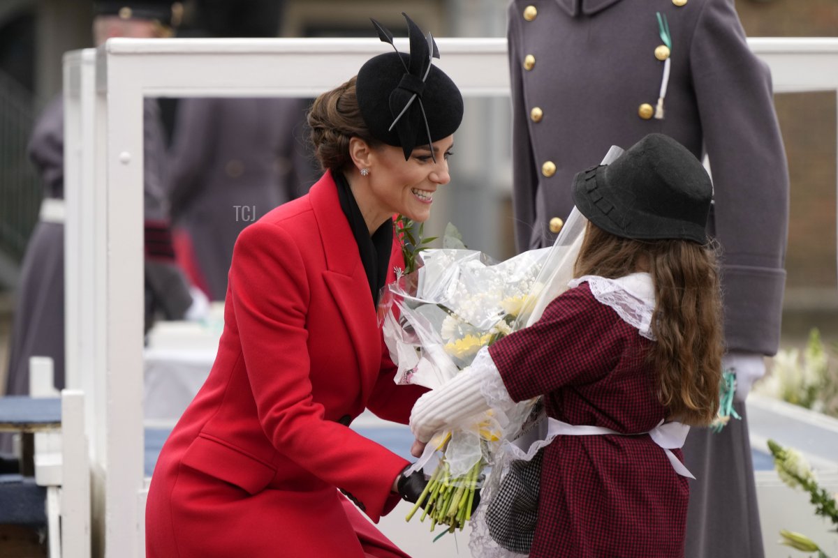 The Princess of Wales receives flowers from a little girl during a visit to the 1st Battalion Welsh Guards at Combermere Barracks for the St David’s Day Parade on March 1, 2023 in Windsor, England (Alastair Grant - WPA Pool/Getty Images)