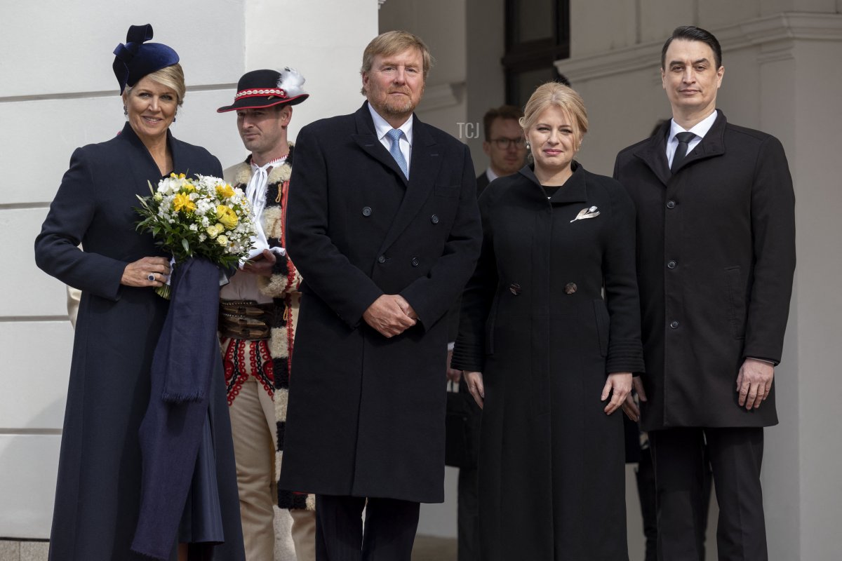Queen Maxima of the Netherlands, King Willem-Alexander of the Netherlands, President Zuzana Caputova of Slovakia, and her partner, Juraj Rizman, pose for a photo before reviewing the Slovak guard of honor during a welcome ceremony at the Presidential Palace in Bratislava, Slovakia, on March 7, 2023 (TOMAS BENEDIKOVIC/AFP via Getty Images)