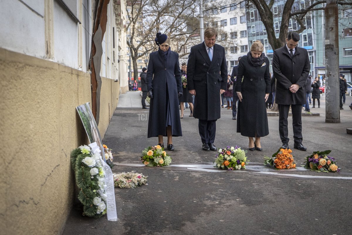 Queen Maxima of the Netherlands, King Willem-Alexander of the Netherlands, President Zuzana Caputova of Slovakia, and her partner, Juraj Rizman, lay flowers on March 7, 2023 at a memorial in Bratislava, Slovakia, dedicated to the assassinated 26-year-old investigative journalist Jan Kuciak and his fiancée, Martina Kusnirova (TOMAS BENEDIKOVIC/AFP via Getty Images)