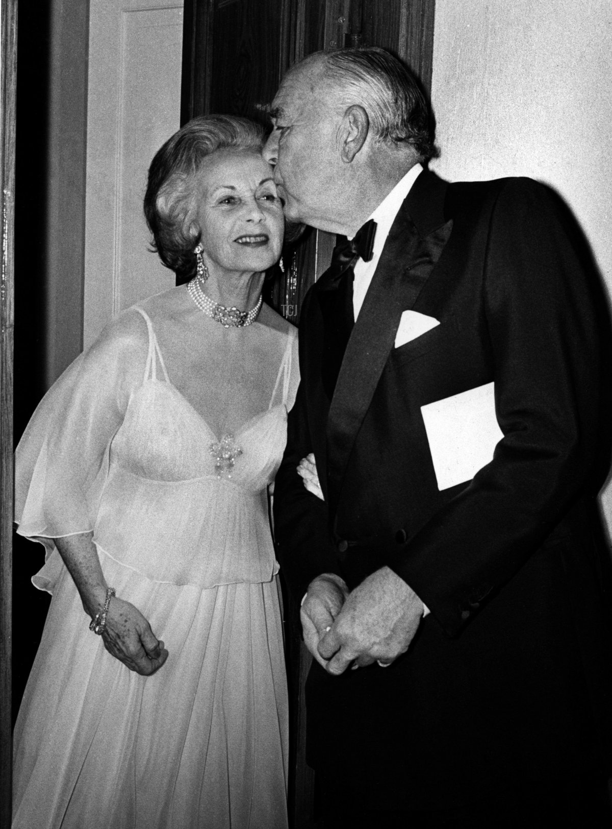 Prince Bertil of Sweden kisses his new wife, Princess Lilian, on the cheek just before their wedding banquet at the Royal Palace in Stockholm, December 7, 1976 (Expressen/Scanpix/TT News Agency/Alamy)