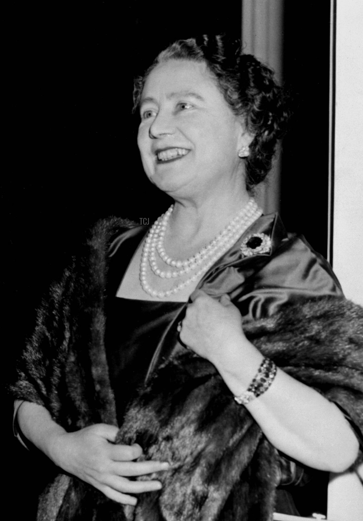The Queen Mother is pictured at Clarence House during the public introduction of Princess Margaret's son, Viscount Linley, on December 1, 1961 (AFP via Getty Images)