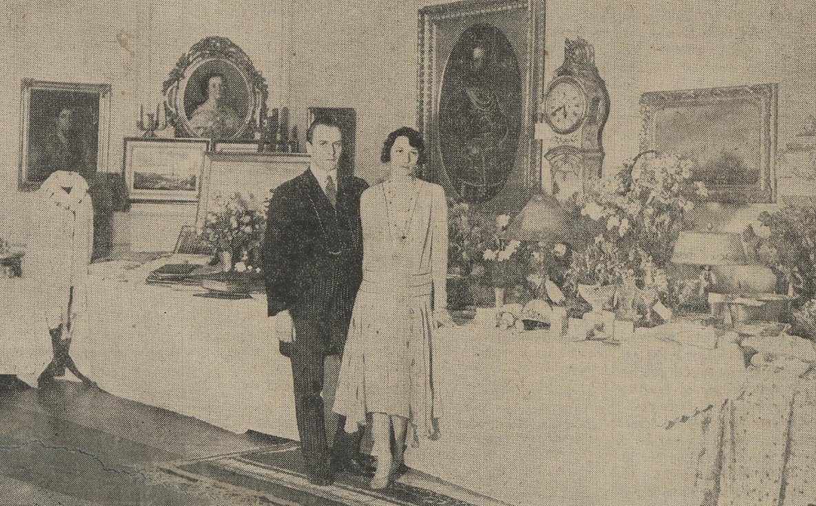Crown Prince Olav of Norway and Princess Martha of Sweden pose with a display of their wedding presents in Stockholm, March 1929 (National Library of Norway)