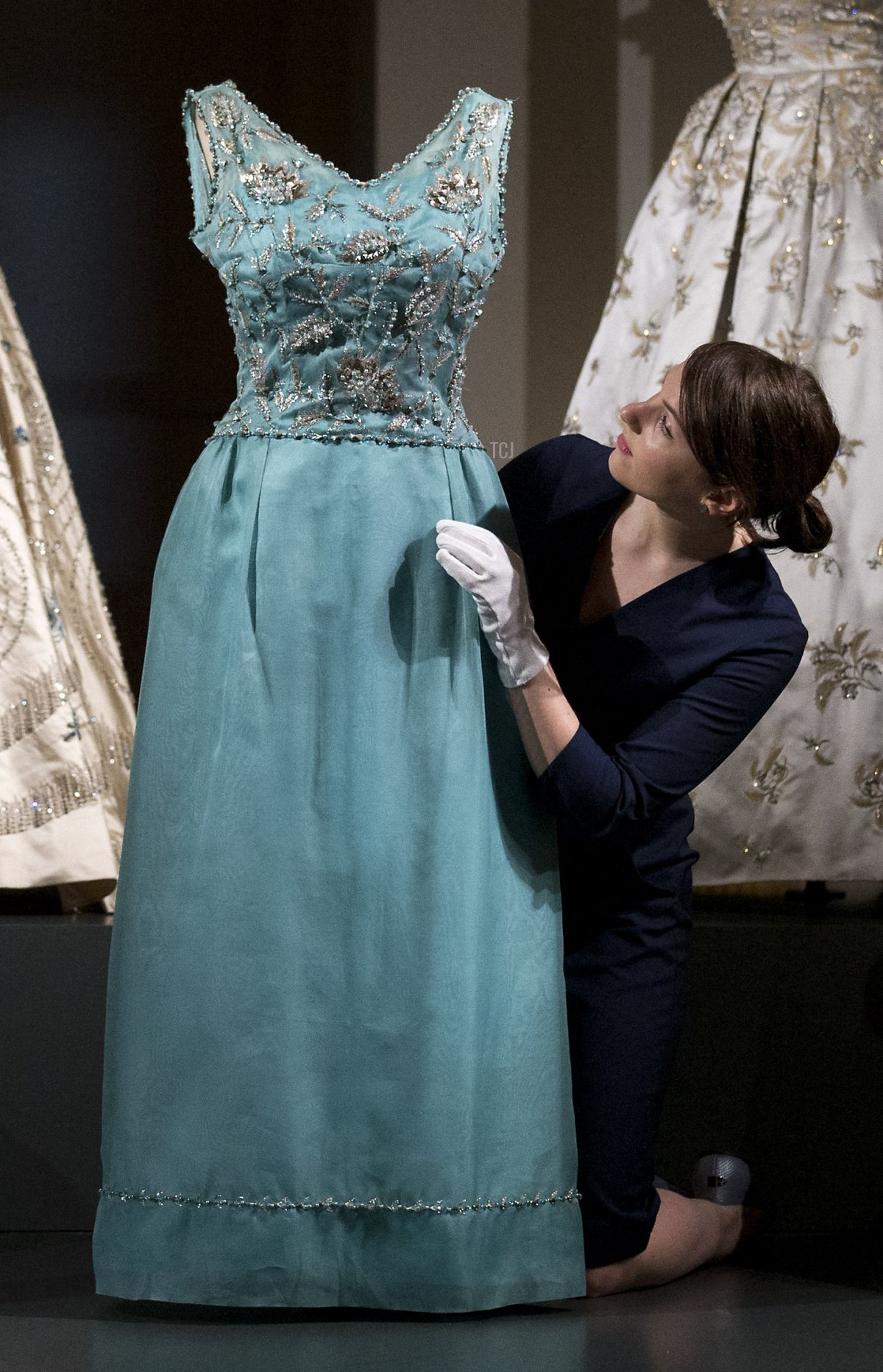 A picture shows exhibits on display at the "Fashioning a Reign: 90 Years of Style from The Queen's Wardrobe" exhibition inside Buckingham Palace in London on July 21, 2016 (JUSTIN TALLIS/AFP via Getty Images)