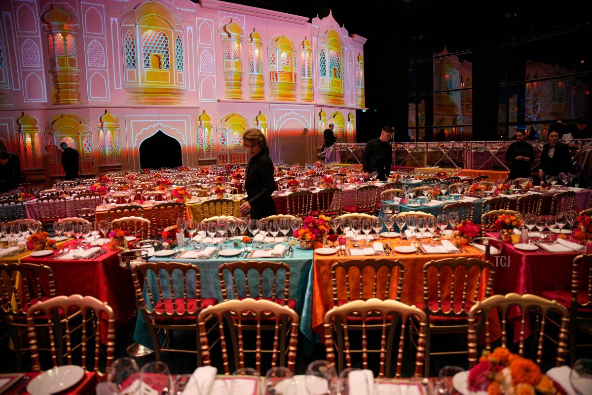 A server prepares a ball room for the "Bal de la Rose," or Rose Ball, in Monaco on March 25, 2023 (DANIEL COLE/POOL/AFP via Getty Images)