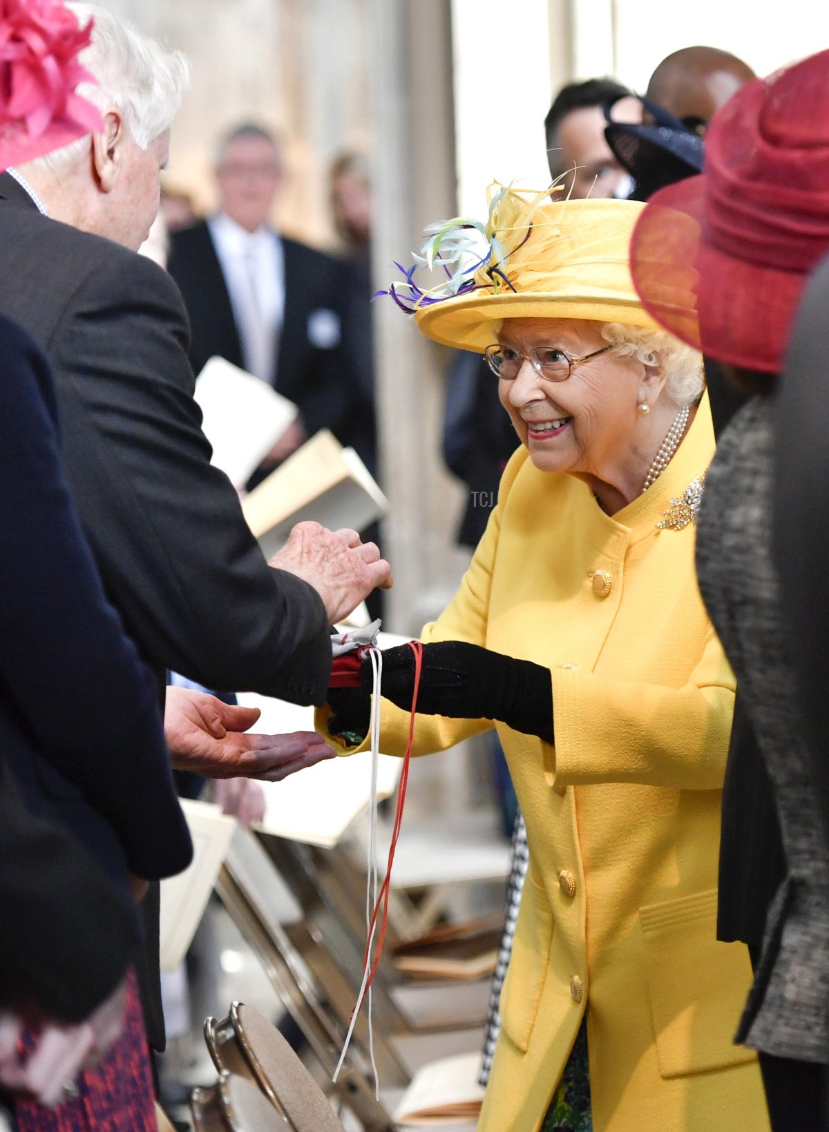 Queen Elizabeth II distributes Maundy money at the traditional Royal Maundy Service at St George's Chapel on April 18, 2019 in Windsor, England (Arthur Edwards - WPA Pool/Getty Images)