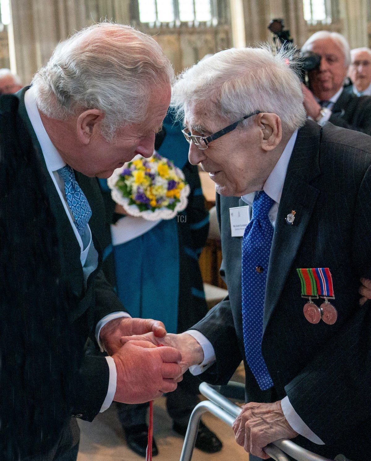 The Prince of Wales distributes Maundy money during the Royal Maundy Service at St George's Chapel in Windsor, west of London on April 14, 2022 (ARTHUR EDWARDS/POOL/AFP via Getty Images)
