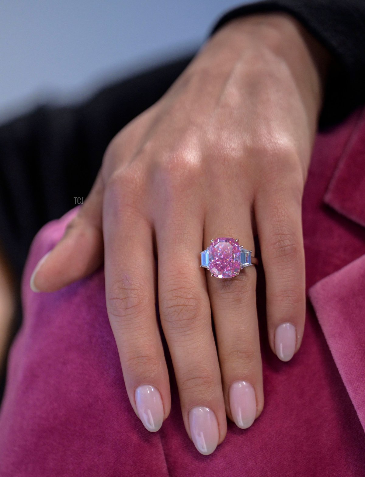 A model wears a 10.57 carat vivid pink diamond, with an estimated value of more than $35 million US dollars, during a press preview at Sotheby's in New York City on March 27, 2023 (ANGELA WEISS/AFP via Getty Images)