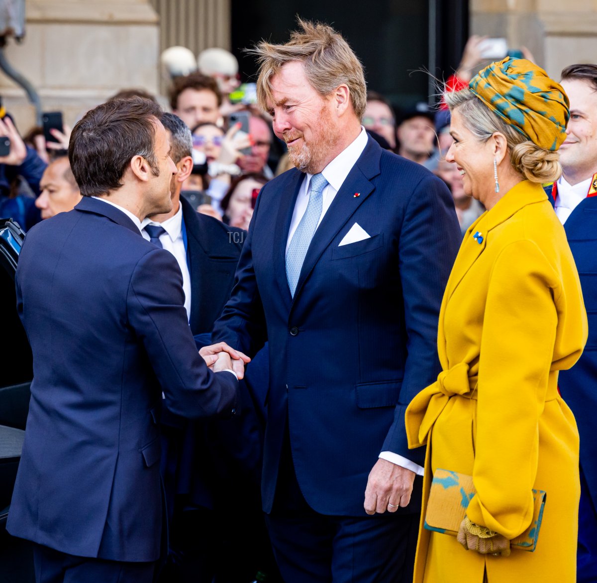 King Willem-Alexander and Queen Maxima of the Netherlands greet French President Emmanuel Macron and his wife, Brigitte Macron, during an official welcome ceremony at the Royal Palace on April 11, 2023 in Amsterdam (Patrick van Katwijk/Getty Images)