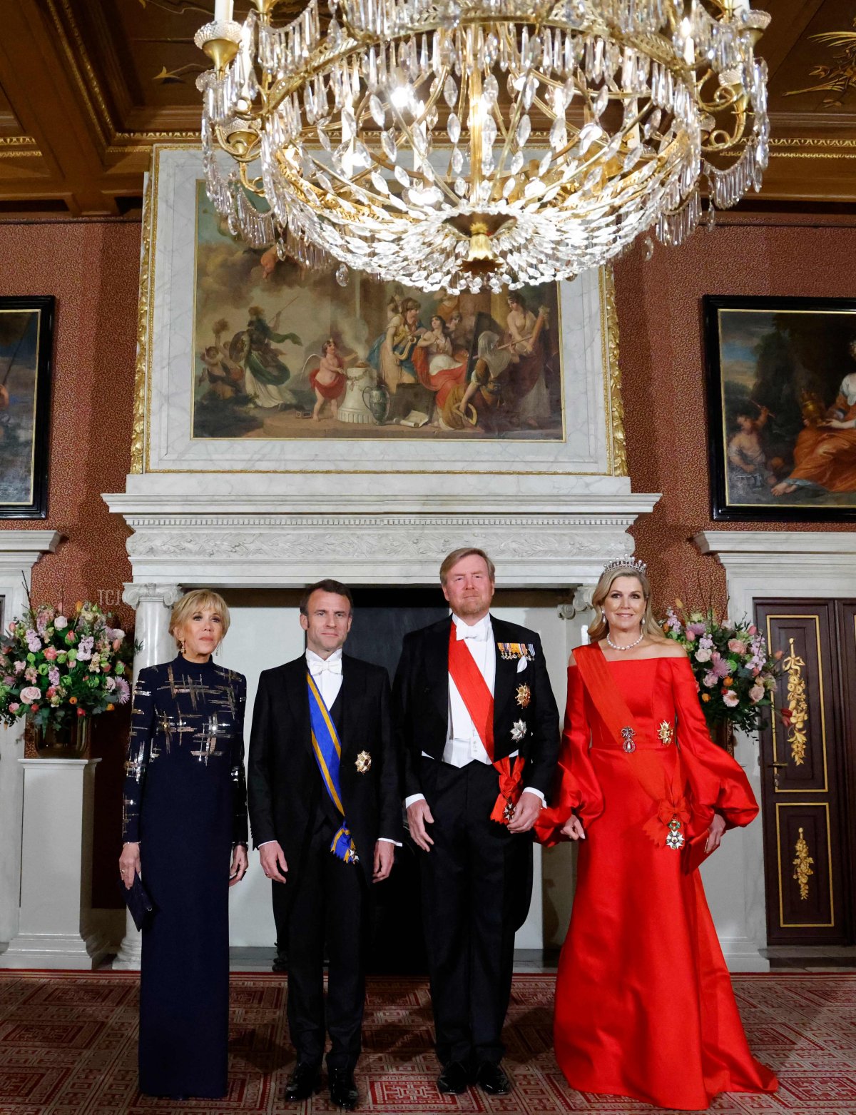 French President Emmanuel Macron and Brigitte Macron and King Willem-Alexander and Queen Maxima of the Netherlands attend a state dinner at the Royal Palace in Amsterdam during the French state visit to the Netherlands on April 11, 2023 (LUDOVIC MARIN/AFP via Getty Images)