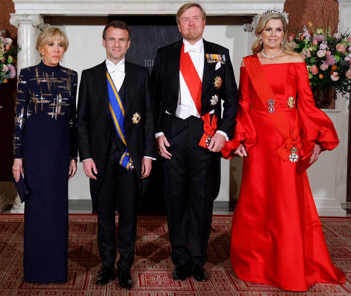 French President Emmanuel Macron and Brigitte Macron and King Willem-Alexander and Queen Maxima of the Netherlands attend a state dinner at the Royal Palace in Amsterdam during the French state visit to the Netherlands on April 11, 2023 (LUDOVIC MARIN/AFP via Getty Images)