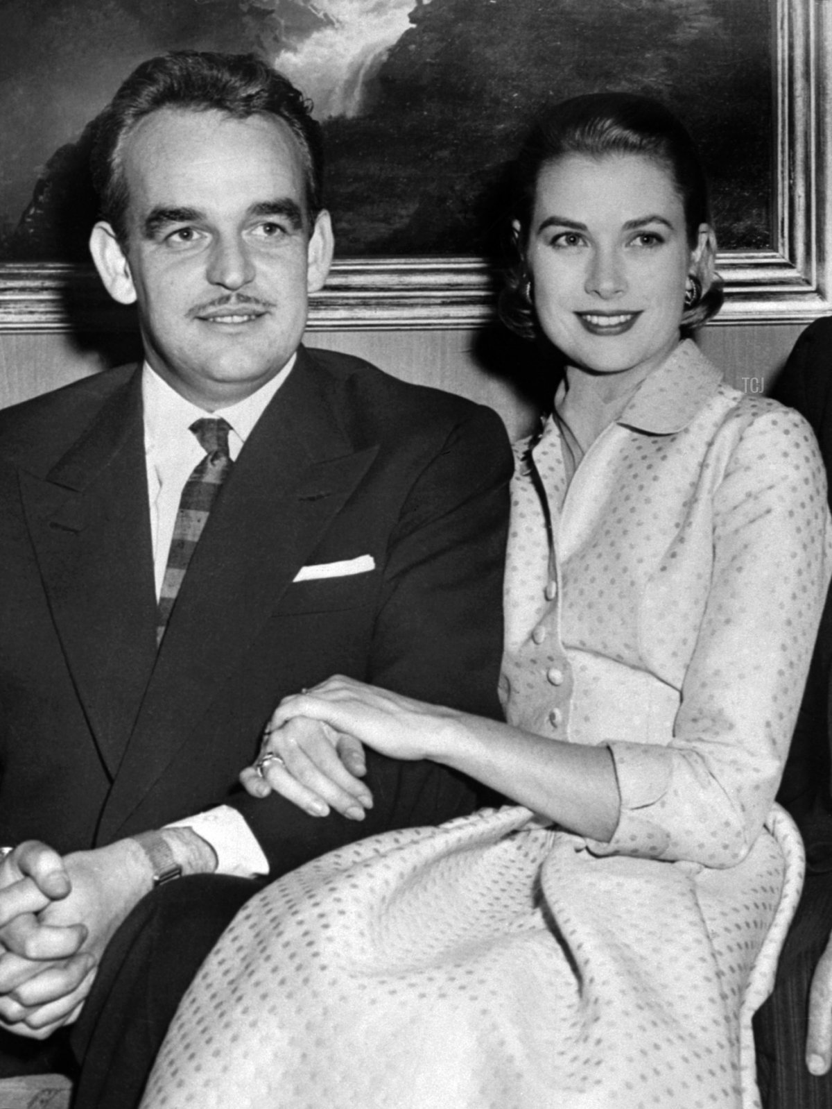 Prince Rainier III of Monaco and Grace Kelly pose for reporters and photographers after announcing their engagement in Philadelphia, January 1956 (AFP via Getty Images)