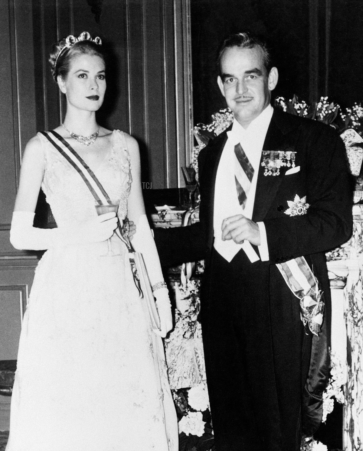 Prince Rainier III and Princess Grace of Monaco pose during their pre-wedding gala at the Opera Garnier in Monaco, April 18, 1956 (Pictorial Press Ltd/Alamy)