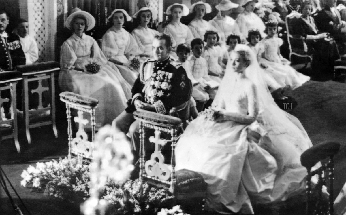 Prince Rainier III of Monaco and Grace Kelly are seen during their wedding ceremony in Monaco's Saint Nicholas Cathedral on April 19, 1956 (AFP via Getty Images)