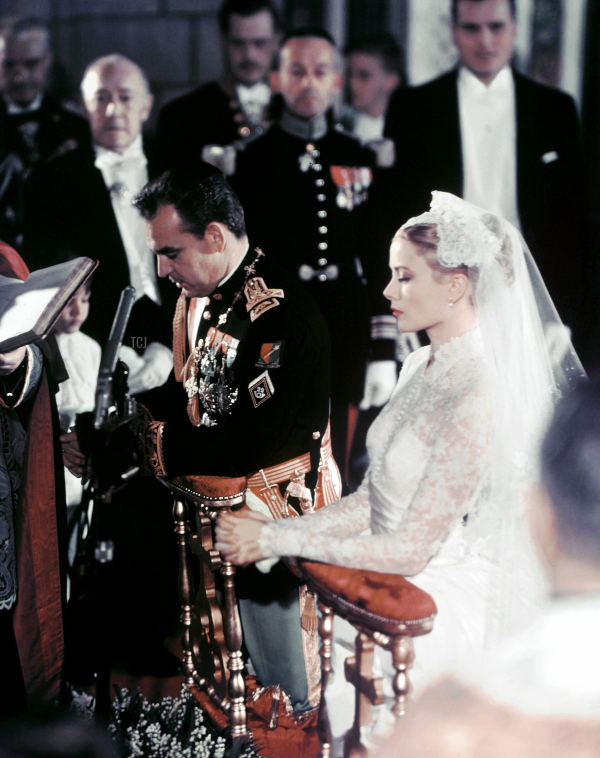 Prince Rainier III of Monaco and Grace Kelly are seen during their wedding ceremony in Monaco's Saint Nicholas Cathedral on April 19, 1956 (AFP via Getty Images)