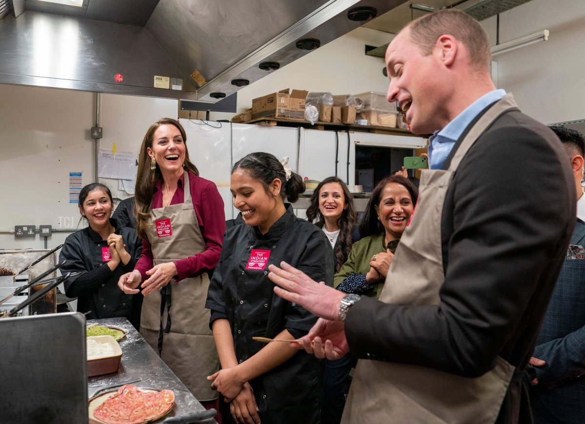 The Prince and Princess of Wales help in the kitchens during a visit The Indian Streatery in Birmingham on April 20, 2023 (ARTHUR EDWARDS/POOL/AFP via Getty Images)