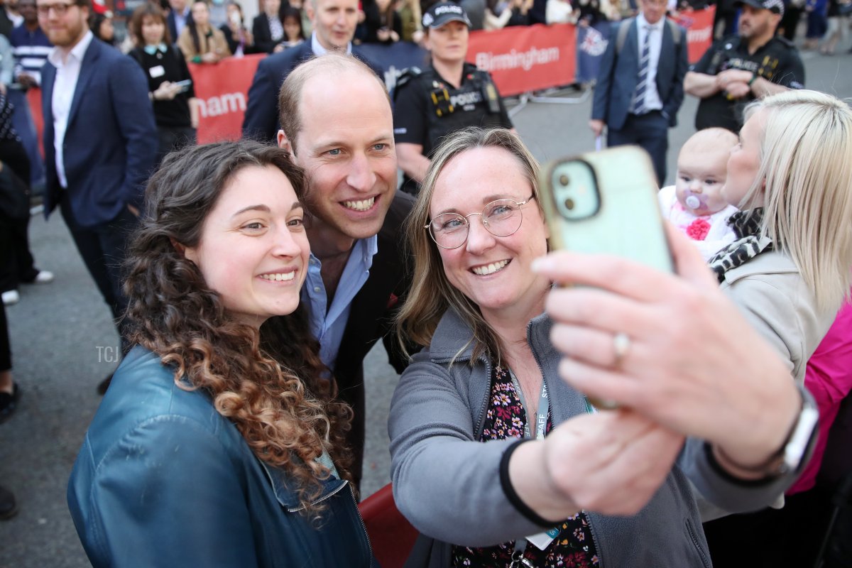 The Prince of Wales poses for a selfie with members of the public after leaving The Rectory during a visit to Birmingham on April 20, 2023 in Birmingham, England (Cameron Smith/Getty Images)