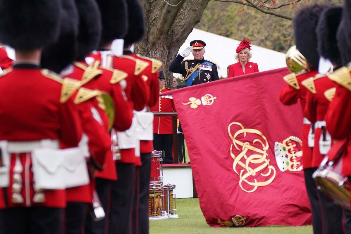 King Charles III and Queen Camilla attend a ceremony to present the new standards and colours to the Royal Navy, the Life Guards of the Household Cavalry Mounted Regiment, The King's Company of the Grenadier Guards and The King's Colour Squadron of the Royal Air Force at Buckingham Palace, in London, on April 27, 2023 (YUI MOK/POOL/AFP via Getty Images)