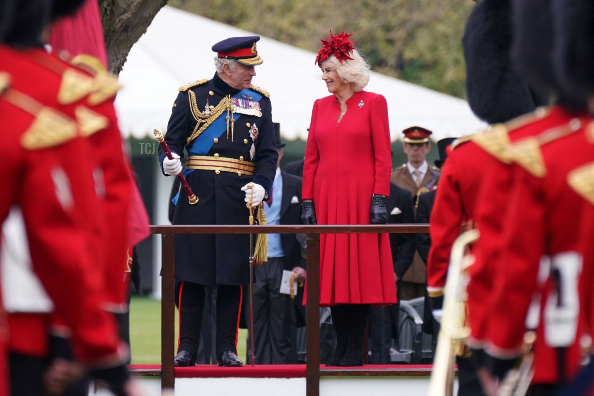 King Charles III and Queen Camilla attend a ceremony to present the new standards and colours to the Royal Navy, the Life Guards of the Household Cavalry Mounted Regiment, The King's Company of the Grenadier Guards and The King's Colour Squadron of the Royal Air Force at Buckingham Palace, in London, on April 27, 2023 (YUI MOK/POOL/AFP via Getty Images)