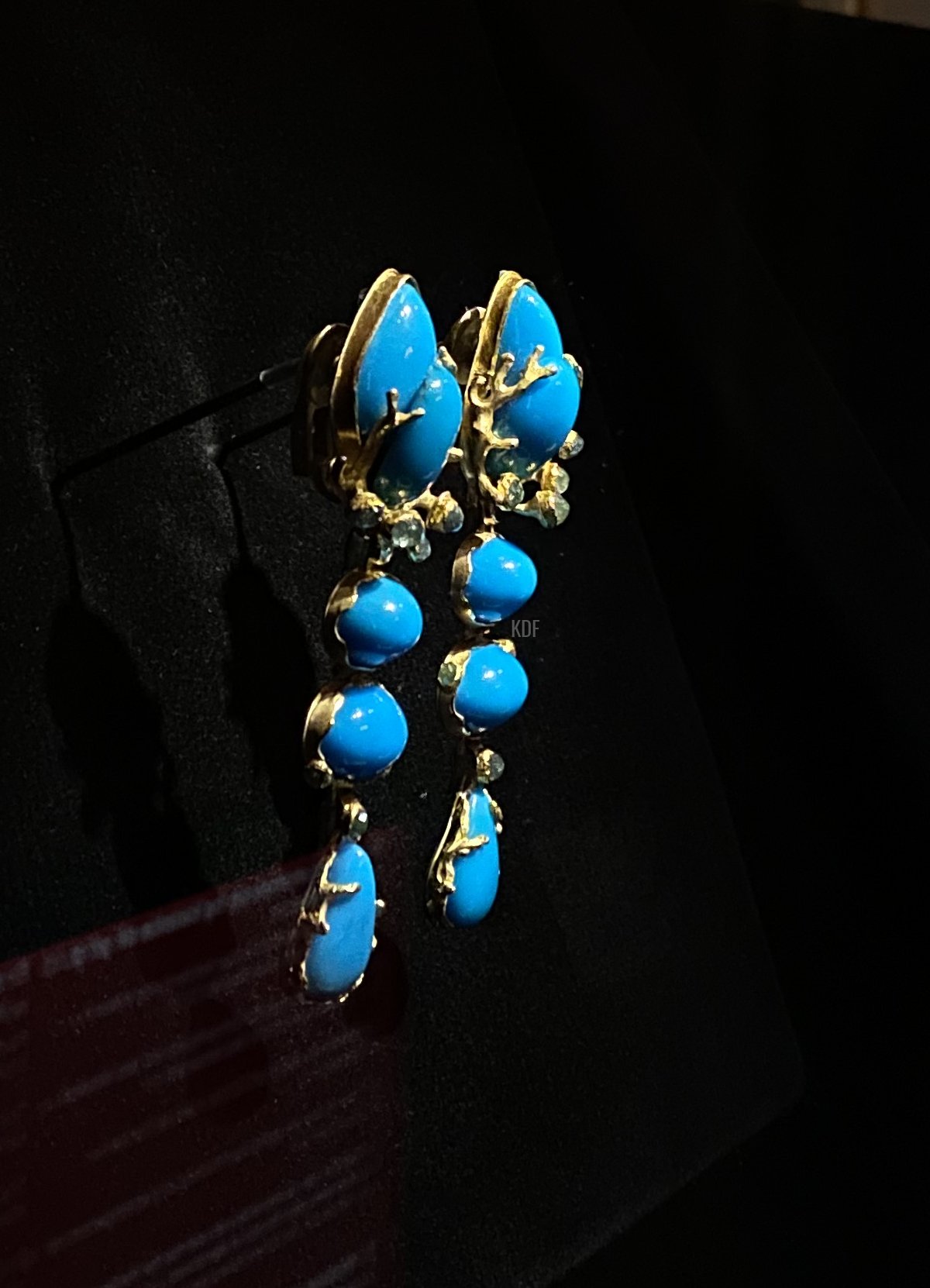 Queen Margrethe II of Denmark's turquoise and gold earrings displayed at Amalienborg Palace, 2022 (Photo generously shared by reader Kim)