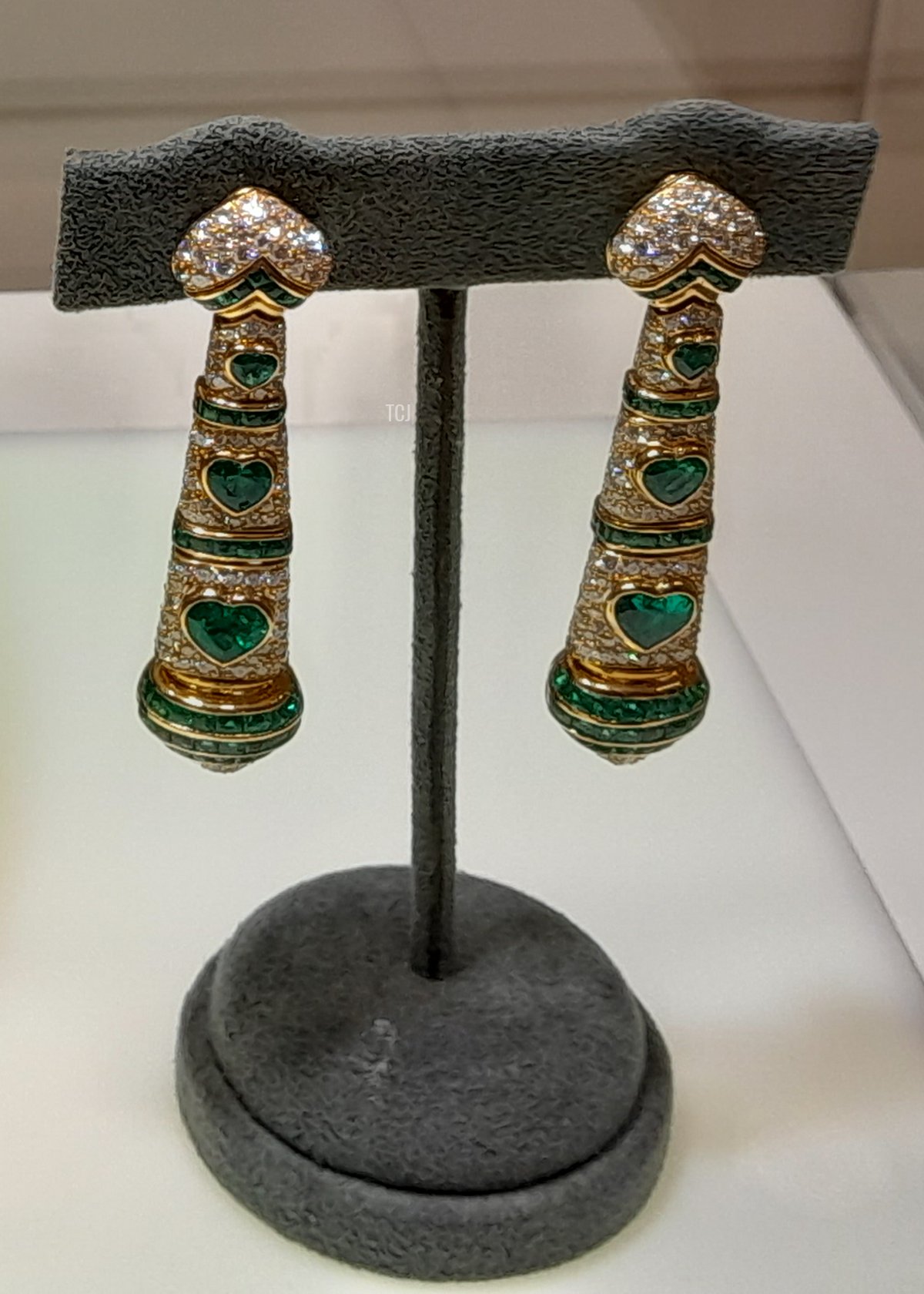 A pair of Bulgari earrings set with diamonds and heart-shaped emeralds in yellow gold, from the Heidi Horten collection sold at Christie's (Photo © Thomas. Do not reproduce.)