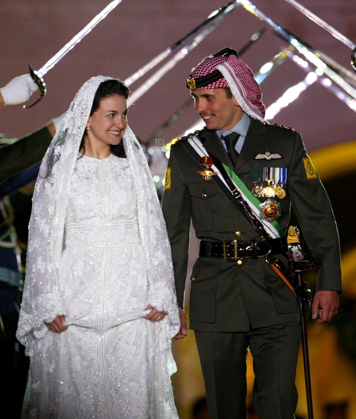 Crown Prince Hamzah of Jordan and Princess Noor are pictured during the public celebrations of their marriage in Amman on May 27, 2004 (Salah Malkawi/Getty Images)