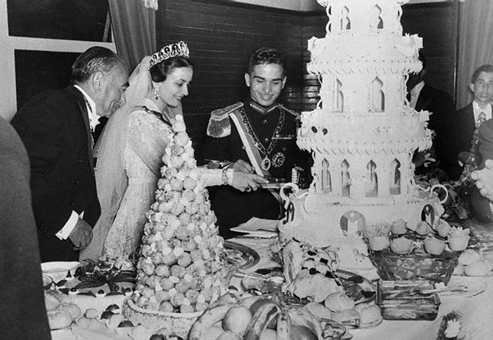 King Hussein of Jordan and Princess Dina are pictured during their wedding celebrations in Amman on April 22, 1955 (AFP via Getty Images)