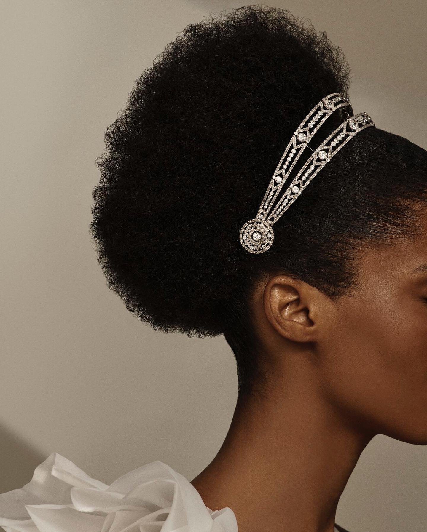 A model wears an early 20th century diamond bandeau from Boucheron (Christie's)