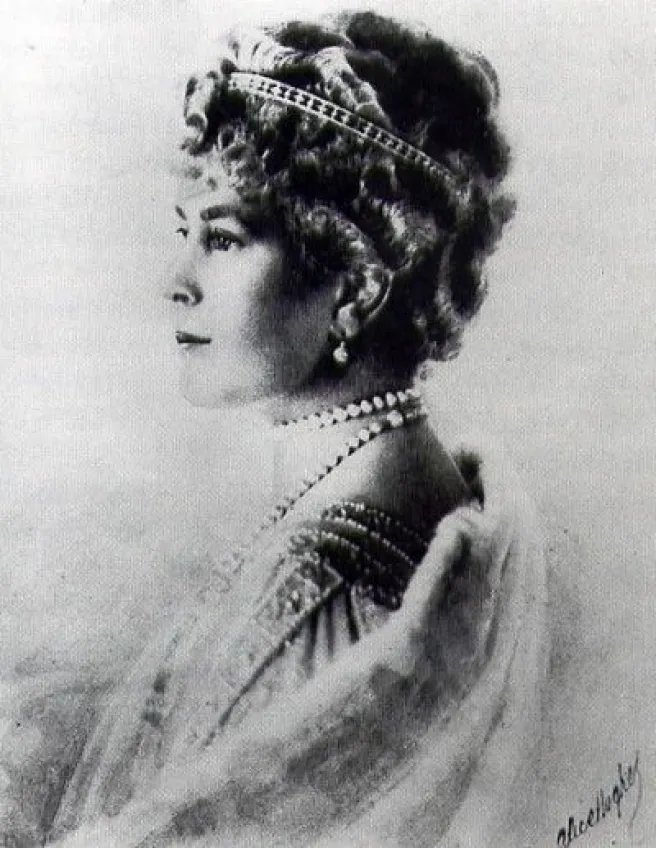 A portrait photograph of Queen Mary of the United Kingdom by Alice Hughes