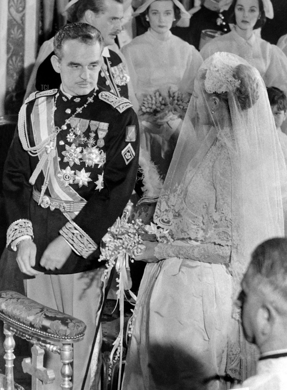 Prince Rainier III of Monaco and Grace Kelly are pictured during their wedding ceremony at Monaco's cathedral on April 19, 1956 (AFP via Getty Images)