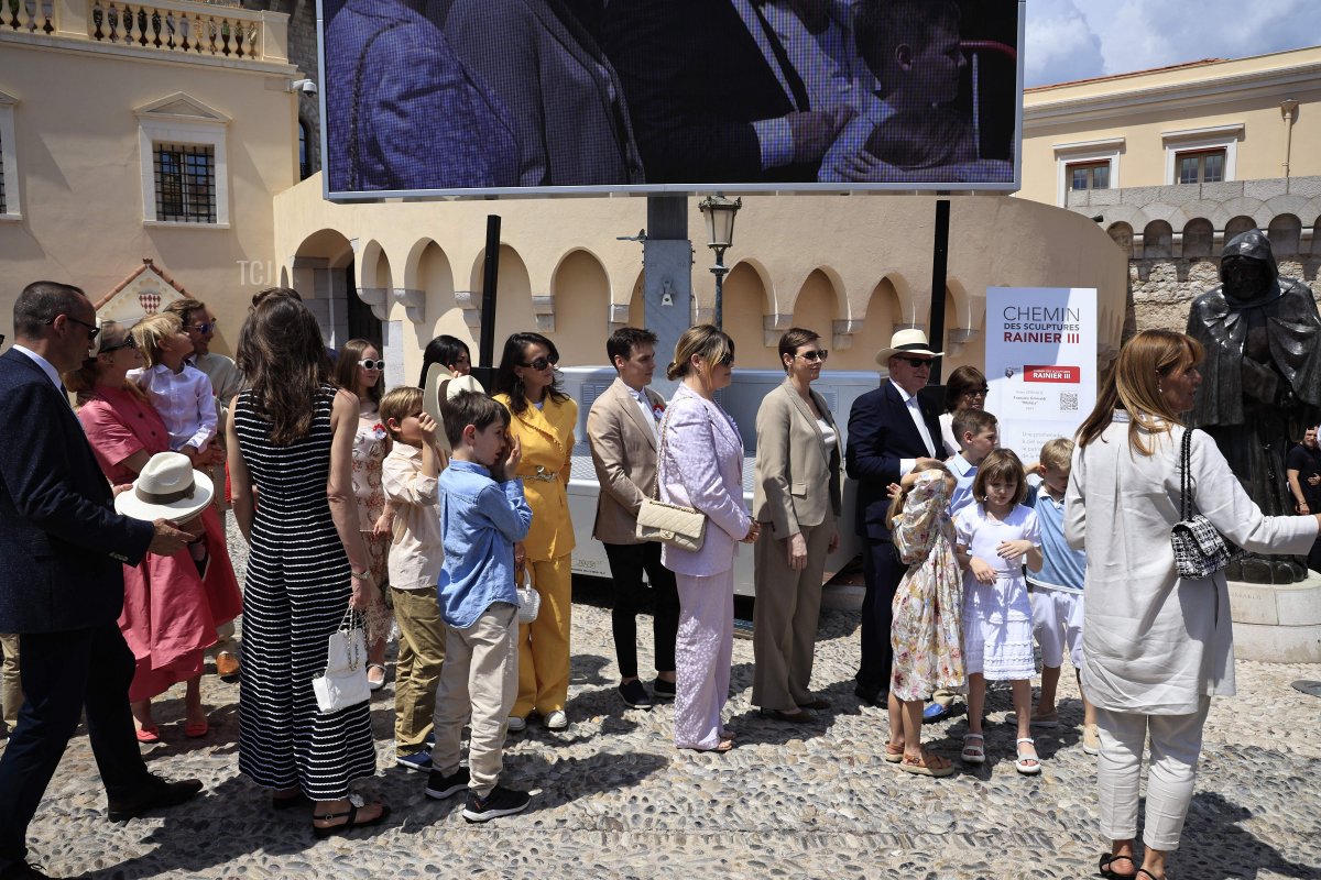 Prince Albert II and Princess Charlene of Monaco, joined by numerous members of the Grimaldi family, arrive for the inauguration of a sculpture walk during celebrations to mark the centenary of the birth of the late Prince Rainier III in Monaco on May 31, 2023 (VALERY HACHE/POOL/AFP via Getty Images)