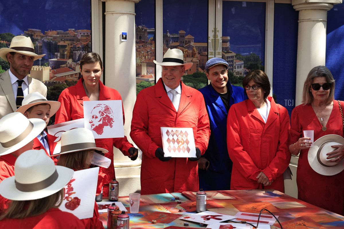 Andrea Casiraghi, Princess Charlene, Prince Albert II, Princess Stephanie, and Princess Caroline of Monaco take part in a painting workshop during celebrations to mark the centenary of the birth of the late Prince Rainier III in Monaco on May 31, 2023 (VALERY HACHE/POOL/AFP via Getty Images)