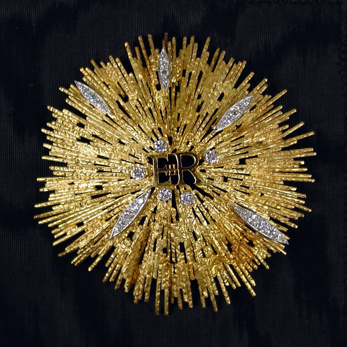 A custom gold and diamond brooch made by Andrew Grima and given to Betty Ford by Queen Elizabeth II and Prince Philip in 1976 is displayed at the Gerald R. Ford Presidential Library and Museum in Grand Rapids, Michigan (National Archives and Records Administration/Wikimedia Commons)