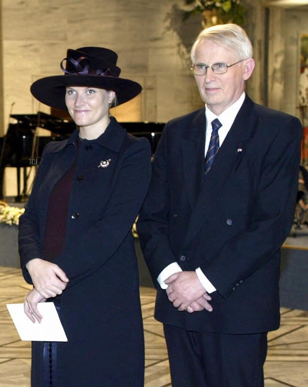 Crown Princess Mette-Marit of Norway and Ole Danbolt Mjos, chairman of the Norwegian Nobel Committee, are pictured during the Nobel Peace Prize ceremony in Oslo on December 10, 2003 (TOR RICHARDSEN/AFP via Getty Images)