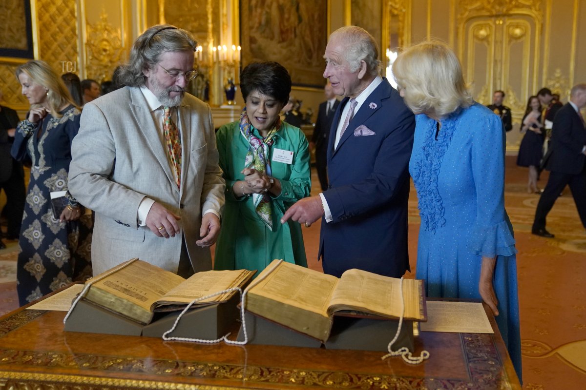 King Charles III and Queen Camilla are shown a first and second folio of works by William Shakespeare by Gregory Doran, Director of the Royal Shakespeare Company and Baroness Vadera, Chair of the Royal Shakespeare Company during a reception at Windsor Castle to celebrate the work of William Shakespeare, on the 400th anniversary of the publication of the First Folio on July 18, 2023 (Andrew Matthews - Pool/Getty Images)