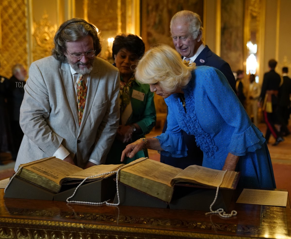 King Charles III and Queen Camilla are shown a first and second folio of works by William Shakespeare by Gregory Doran, Director of the Royal Shakespeare Company and Baroness Vadera, Chair of the Royal Shakespeare Company during a reception at Windsor Castle to celebrate the work of William Shakespeare, on the 400th anniversary of the publication of the First Folio on July 18, 2023 (Andrew Matthews - Pool/Getty Images)