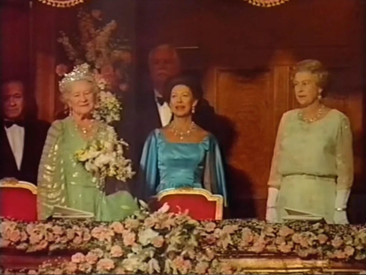 The Queen Mother, with Queen Elizabeth II and Princess Margaret, attends a 90th birthday gala in her honor at the London Palladium, July 19, 1990 (screencapture)