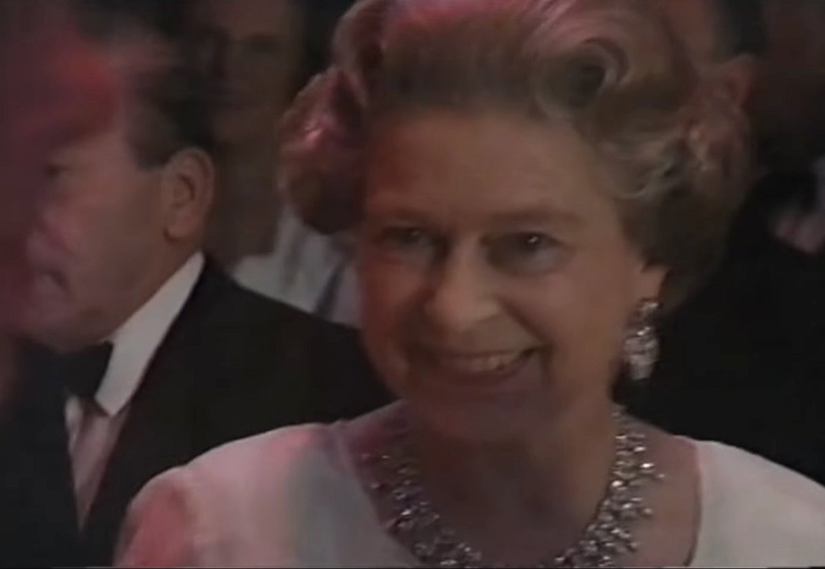Queen Elizabeth II attends a 90th birthday gala in honor of the Queen Mother at the London Palladium, July 19, 1990 (screencapture)