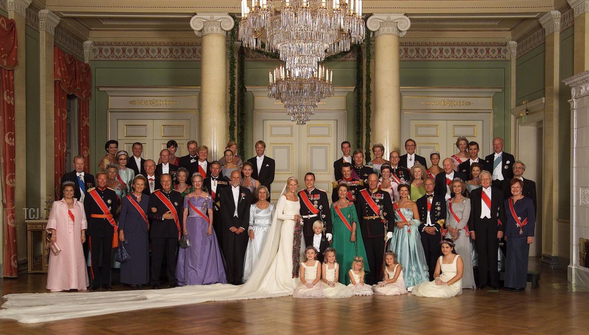 The Crown Prince and Crown Princess of Norway are pictured with family and other dignitaries on their wedding day in Oslo, August 25, 2001 (AFP via Getty Images)