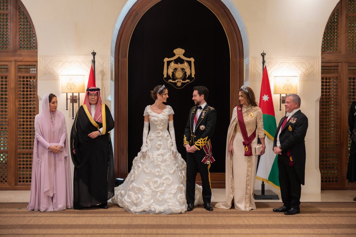 Crown Prince Hussein and Princess Rajwa of Jordan pose with their parents ahead of a banquet celebrating their wedding in Amman on June 1, 2023 (Royal Hashemite Court)