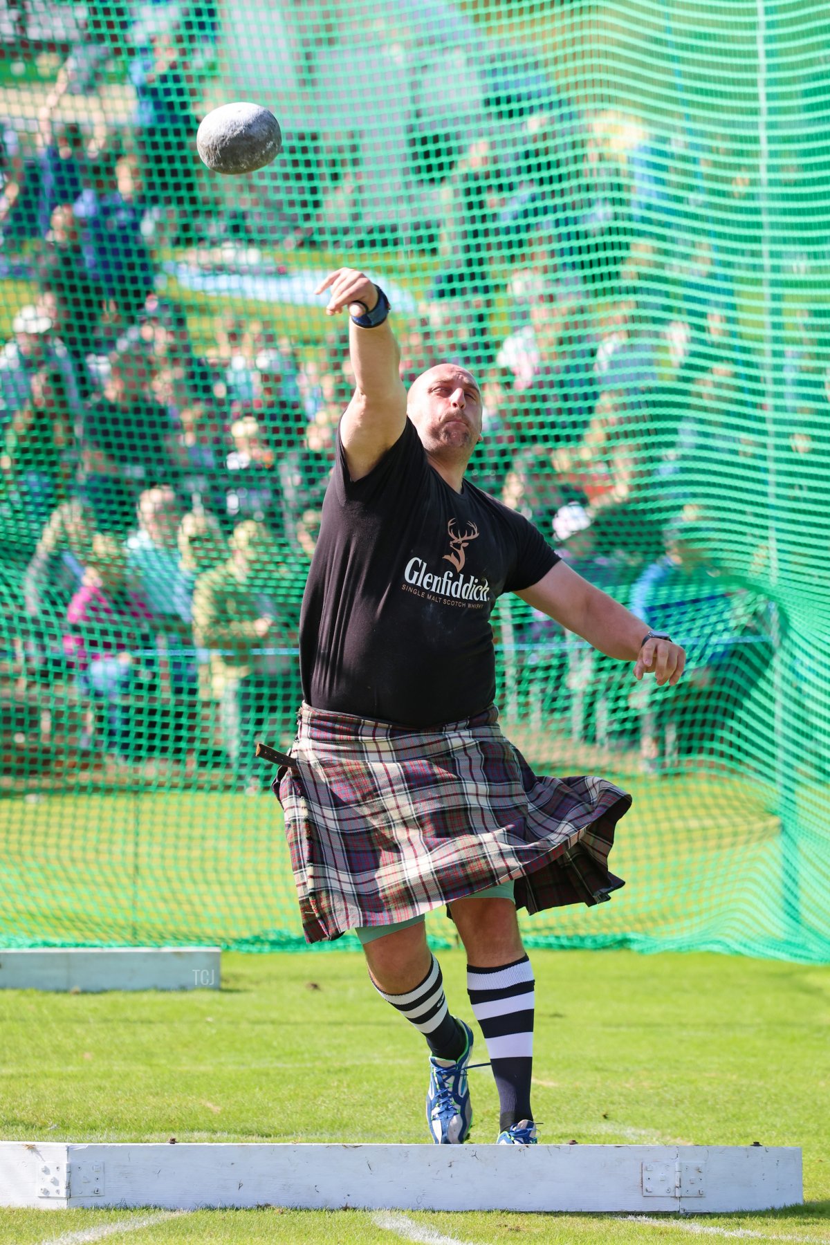 A competitor in the stone put event is pictured at the Braemar Gathering at the Princess Royal and Duke of Fife Memorial Park in Braemar, Scotland, on September 02, 2023 (Chris Jackson/Getty Images)