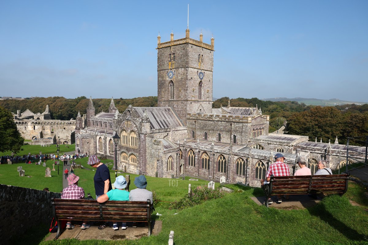 People gather outside of St. David's Cathedral in Pembrokeshire, Wales, ahead of a service to commemorate the first anniversary of the death of Queen Elizabeth II, September 8, 2023 (Toby Melville - Pool/Getty Images)