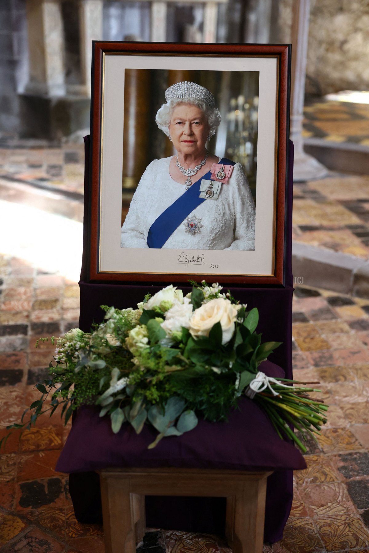 A portrait of the late Queen Elizabeth II is displayed inside St. David's Cathedral in Pembrokeshire, Wales, after a service to commemorate the first anniversary of her death, September 8, 2023 (Toby Melville - Pool/Getty Images)
