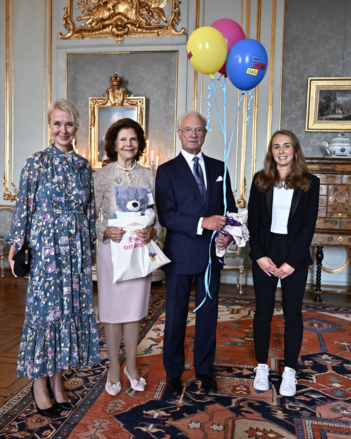 During a reception at the Royal Palace in Stockholm, King Carl XVI Gustaf and Queen Silvia of Sweden receive Golden Jubilee gifts from Jennifer McShane and Ava Thunberg of the My Special Day foundation, September 13, 2023 (Jonas Ekströmer/TT News Agency/Alamy)