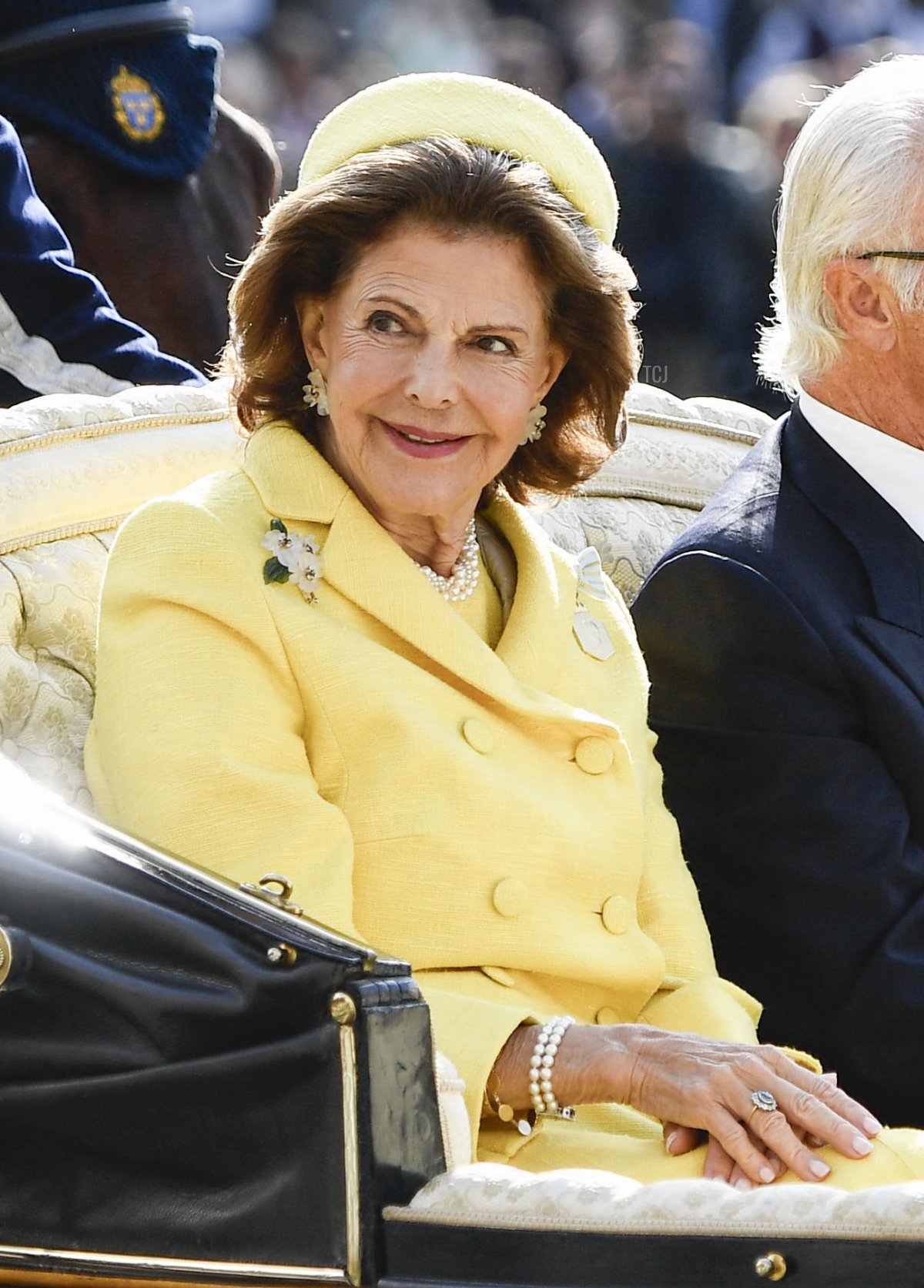 King Carl XVI Gustaf and Queen Silvia of Sweden ride through Stockholm in an open carriage during the Golden Jubilee procession on September 16, 2023 (MIKAELA LANDESTROEM/TT NEWS AGENCY/AFP via Getty Images)